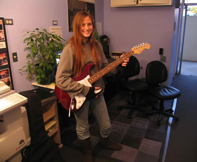guitar school contest winner audrey and her strat