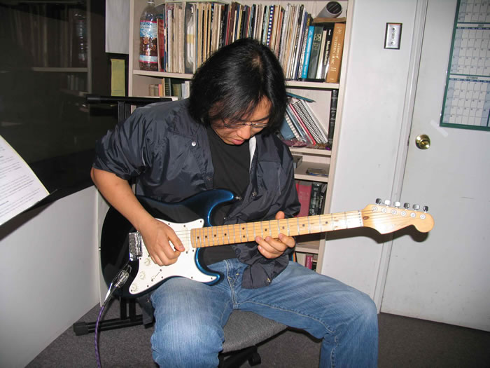 john whang redondo guitar school student in a guitar lesson with instructor mark fitchett